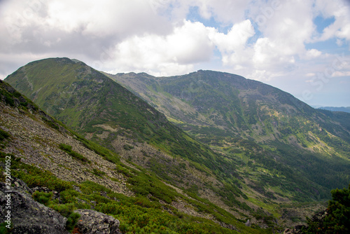  The mountain ranges of Satan and Hamar-Daban. Mountain peaks and valleys. Mountain landscape. The nature of Siberia.