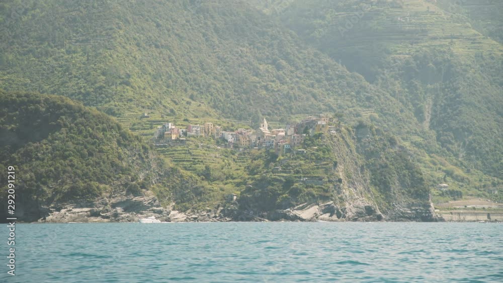 Corniglia coast on beautiful sunny day. Italy. Panning travel by boat. Corniglia coast on beautiful sunny day. Italy. Panning travel by boat.