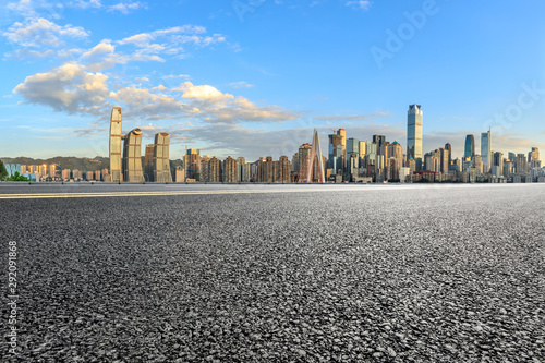 Asphalt highway passes through the city financial district in Chongqing at sunset,China.