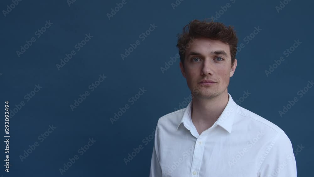 Caucasian Male Model in White Polo Standing Still Caucasian Male Model in White Polo Standing Still