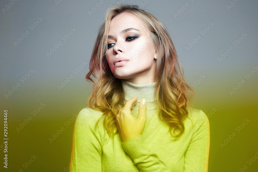 Fototapeta premium Beautiful woman in yellow color film. amazing curly girl