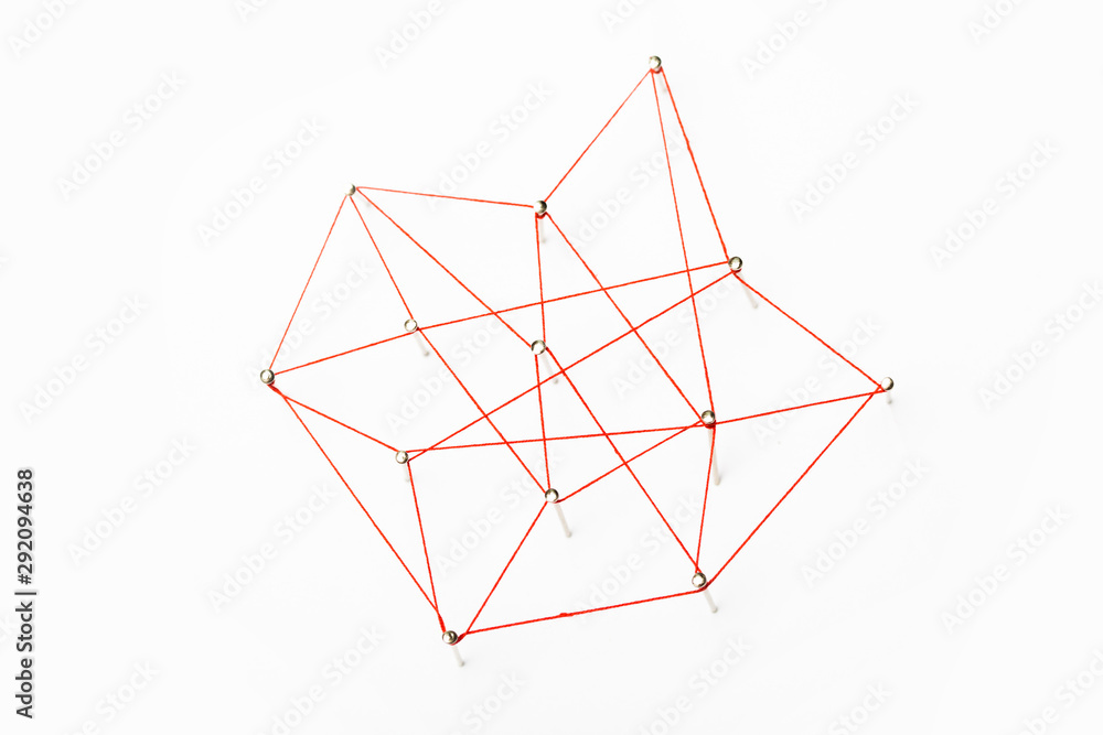 A large grid of pins connected with string. Communication, network concept