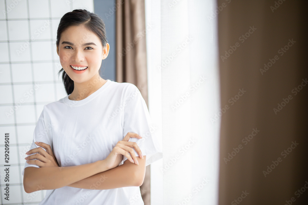 Close up young woman smiling face with clean skin in room Close up young woman smiling face with clean skin in room