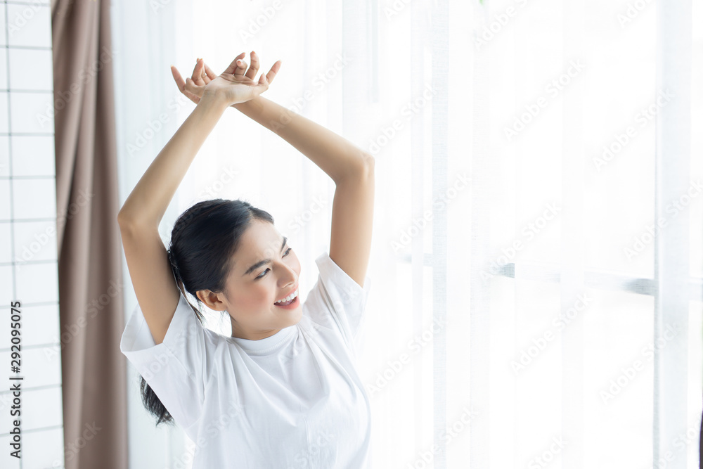 Asian women relaxed Beautiful is Waking up in the Morning, Stretches in the Bed. Asian women relaxed Beautiful is Waking up in the Morning, Stretches in the Bed.
