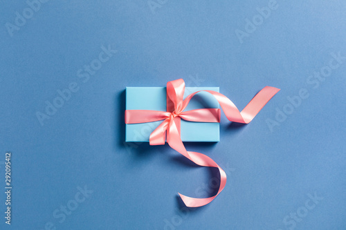Holiday card. A blue box with a pink bow.