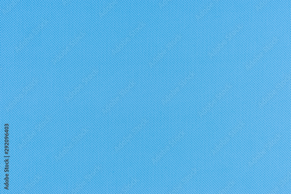 Blue texture of fabric from a textile material. Blue texture of fabric from a textile material.