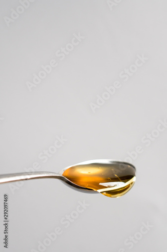 spoonful of honey with bubbles
