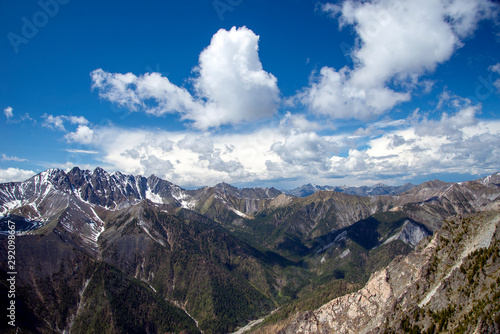 Fototapeta Naklejka Na Ścianę i Meble -   The mountain ranges of Satan and Hamar-Daban. Mountain peaks and valleys. Mountain landscape. The nature of Siberia.