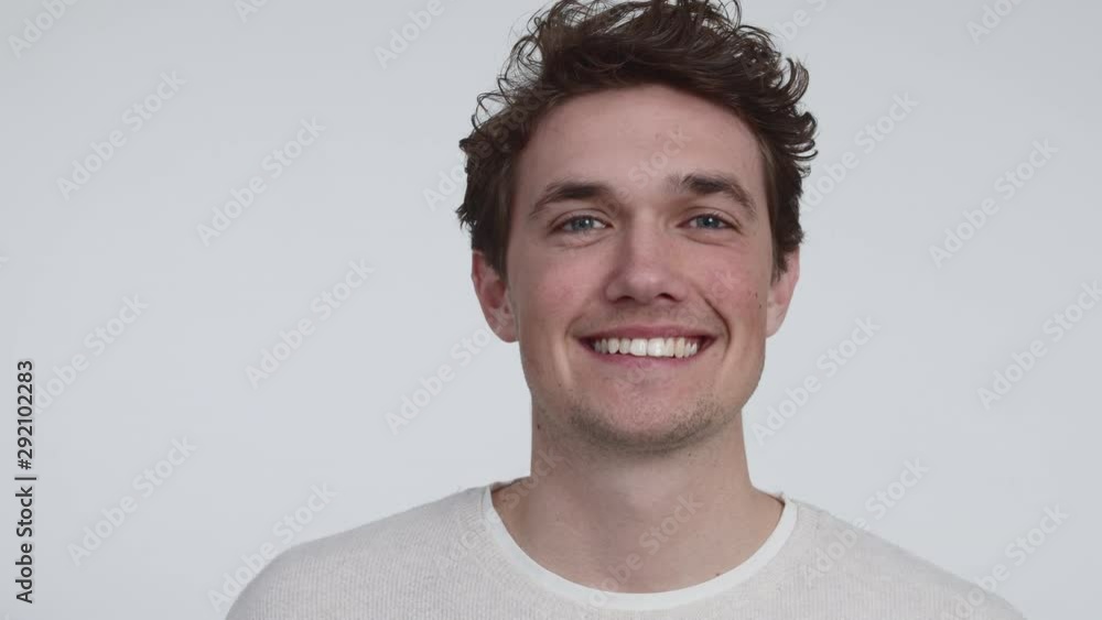 Portrait Shot of a Young Man with Beautiful Eyes Smilling