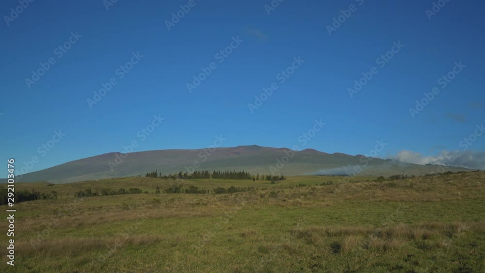 Saddle Road Big Island Roadway side view hills mountains blue sky. Mauna Kea Telescopes Saddle Road Big Island Roadway side view hills mountains blue sky. Mauna Kea Telescopes