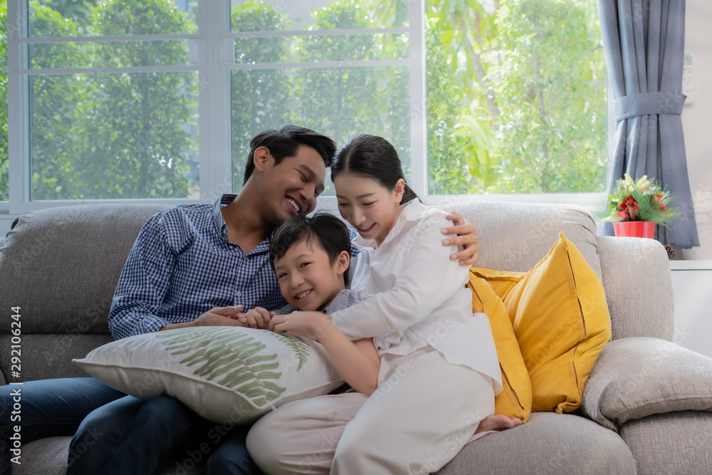 Asian family father, mother and son playing together in living room, happy family concept Asian family father, mother and son playing together in living room, happy family concept