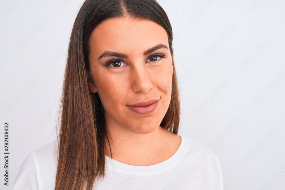 Close up of beautiful and young brunette woman standing over isolated white background with a confident expression on smart face thinking serious Close up of beautiful and young brunette woman standing over isolated white background with a confident expression on smart face thinking serious