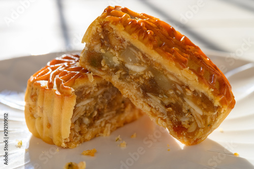cut out traditional Chinese mooncake in a sunny morning the Chinese on top means nuts