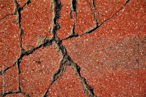 cracks on the red paving slabs