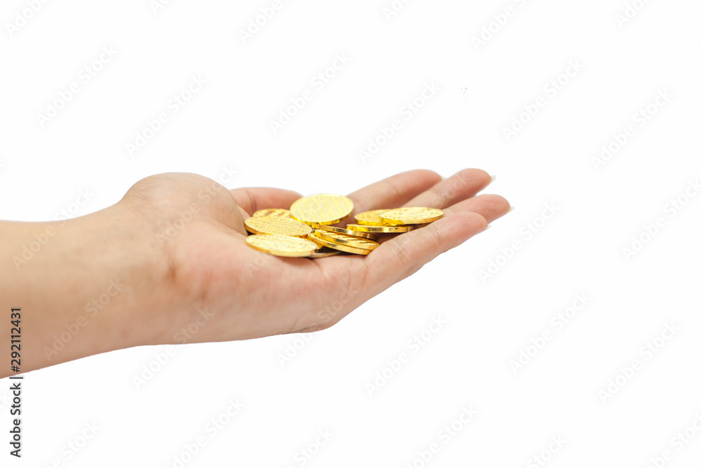 Fototapeta premium Hand holding gold coins isolated on white, A pile of Coins, investment concept, stack of gold, white background, pure gold, Saving, Coin stack growing business. Investment money concept.