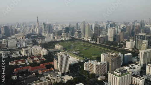 4K Aerial Drone Cityscape of Sukhumvit area and golf course in Bangkok Thailand photo