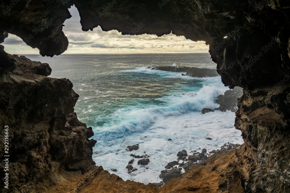 Hole to the pacific ocean inside lava cave, Easter Island