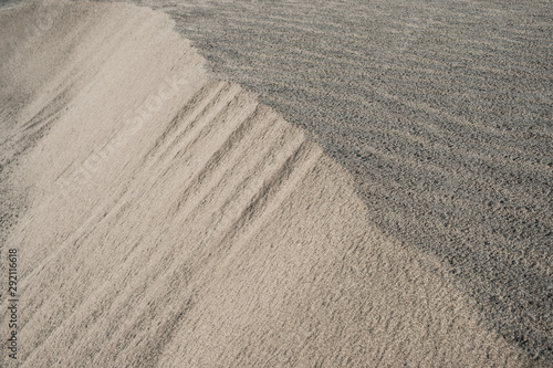 Sand dunes sloping like ridges.