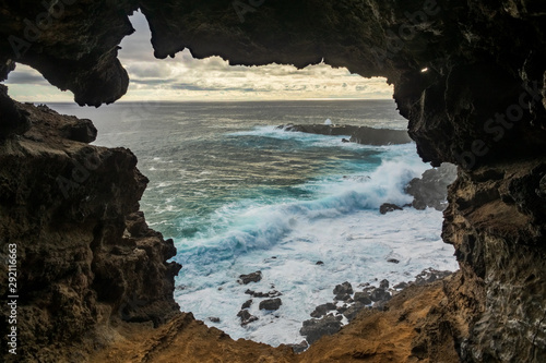 Hole to the pacific ocean inside lava cave, Easter Island