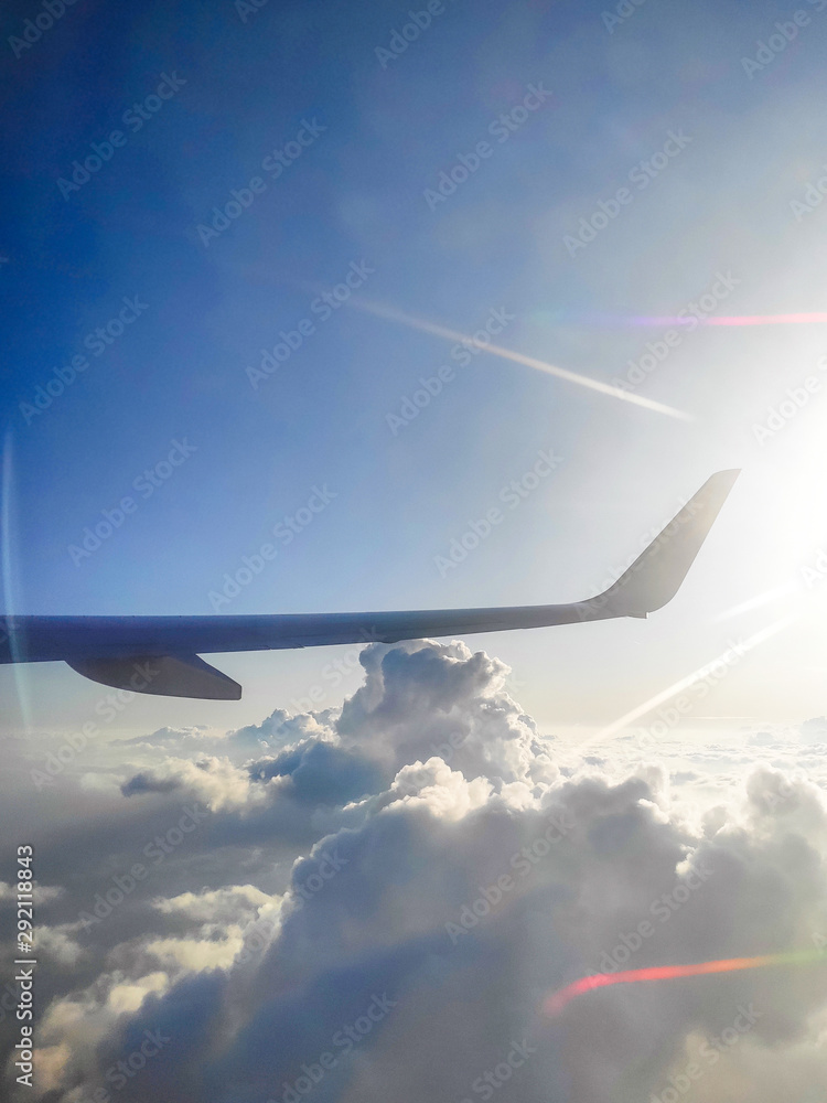 The view from the airplane window. Blue sky and clouds. The view from the airplane window. Blue sky and clouds.