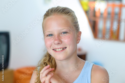 A teenage girl with a removable orthodontic appliance. Smiling with a bracket on her teeth. The concept of pediatric dentistry, bite correction. Portrait