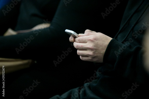 Businessman Texting During Meeting In Office
