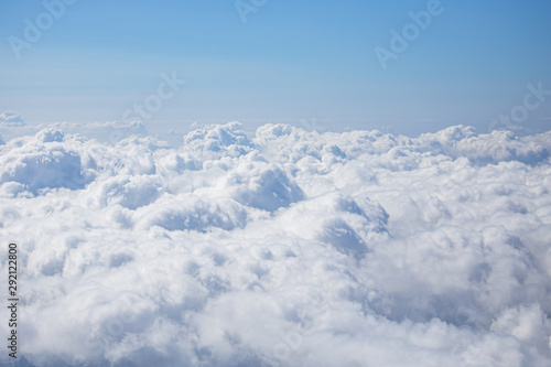 top view from airplane window of blue sky with cloudy background. © pim pic