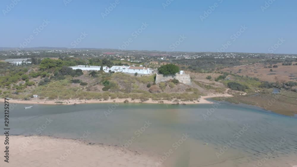 Aerial view of small village surrounded by beautiful bay where the river flows into the ocean. Aerial view of small village surrounded by beautiful bay where the river flows into the ocean.