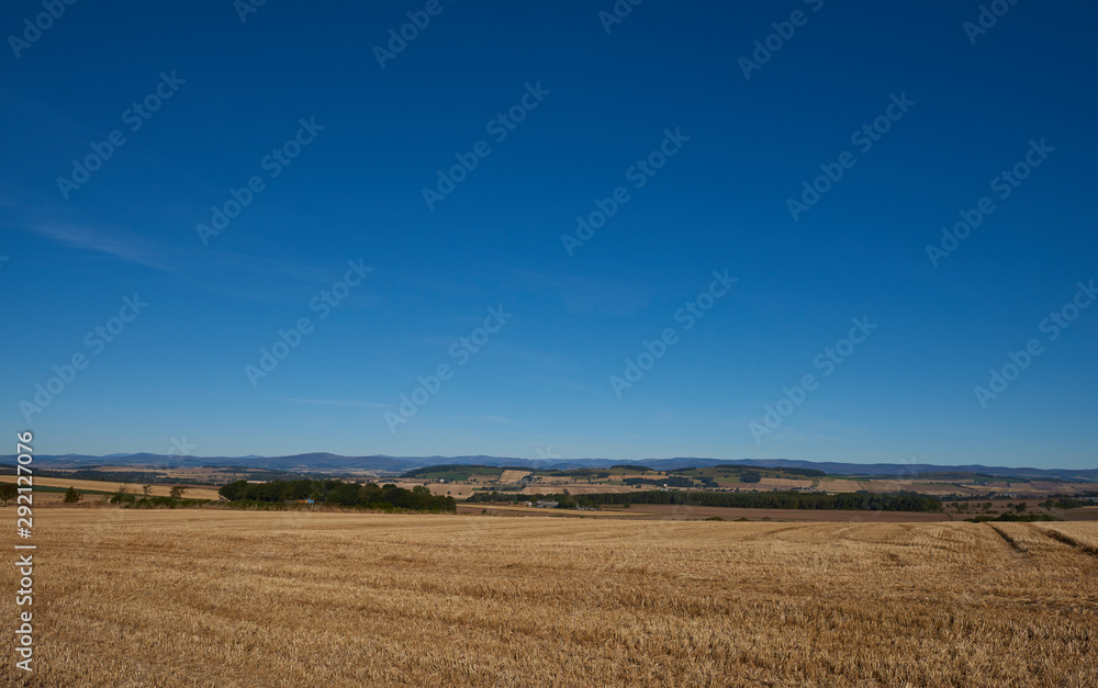 Looking over farmland on a clear Septembers day in the Strathmore Valley of Scotland.