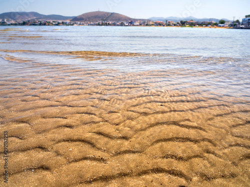 Panoramic views of the sandy beach,  mountains  the island of Evia on Liani Ammos beach in Halkida, Greece on a Sunny summer day photo