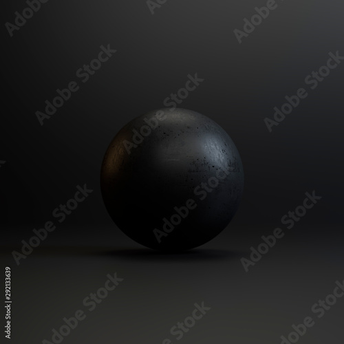 Black stone on a black background in the studio with texture