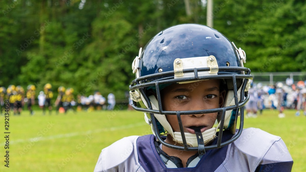 american football player with helmet on his head american football player with helmet on his head
