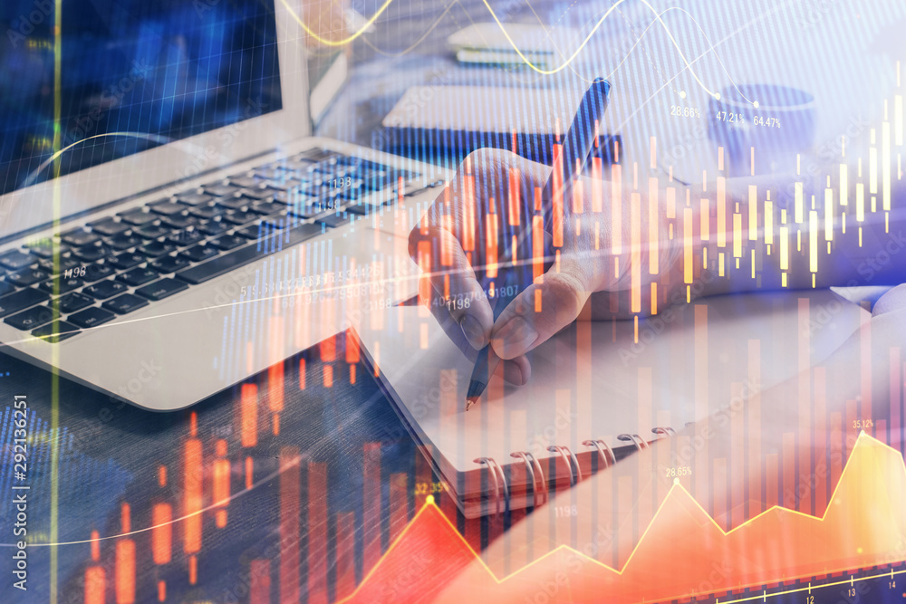 Forex chart displayed on woman's hand taking notes background. Concept of research. Multi exposure Forex chart displayed on woman's hand taking notes background. Concept of research. Multi exposure