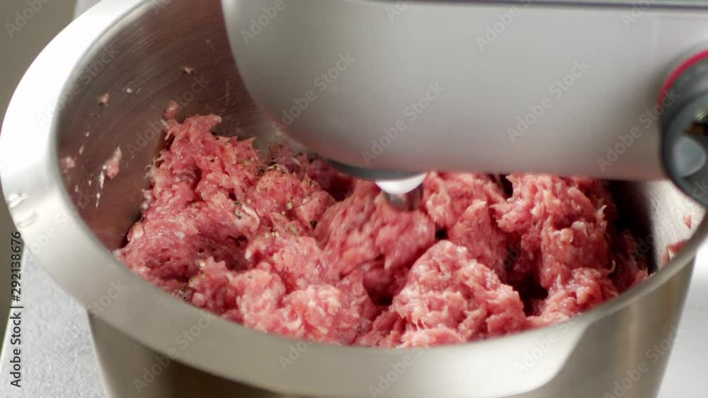 Preparation of minced meat. Mechanical mixing with a food processor. Adding spices. Slow motion. Preparation of minced meat. Mechanical mixing with a food processor. Adding spices. Slow motion.