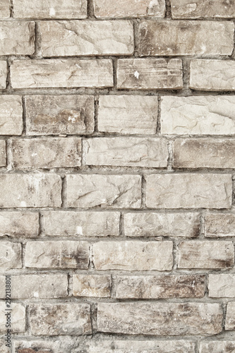Wall of stone grey bricks, abstract background. Brick wall building