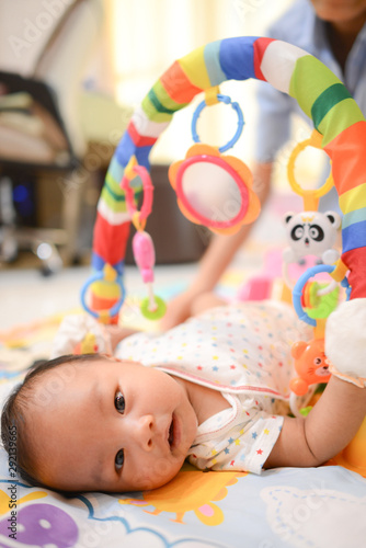 Cute little Asian baby playing Playgym photo