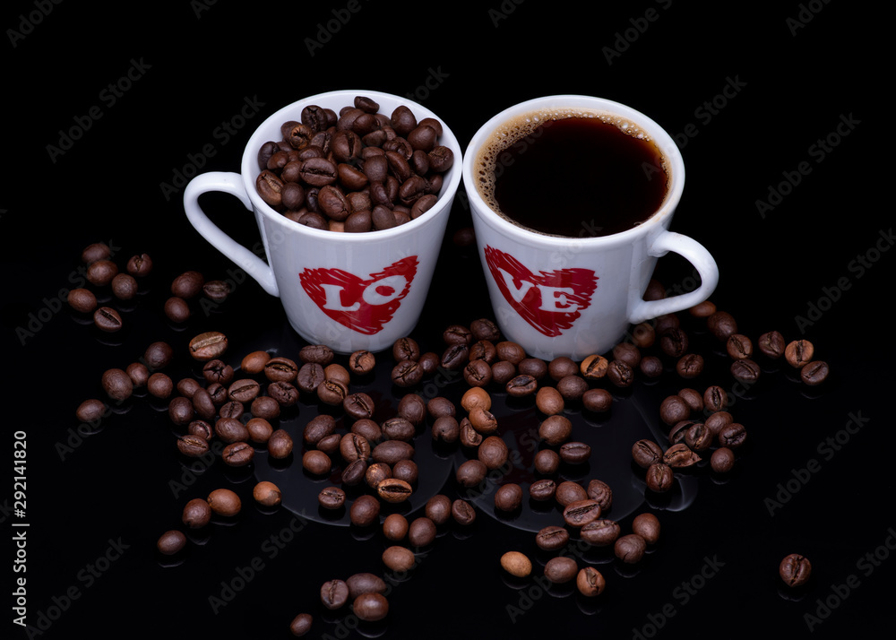 cup of coffee with beans on black background cup of coffee with beans on black background
