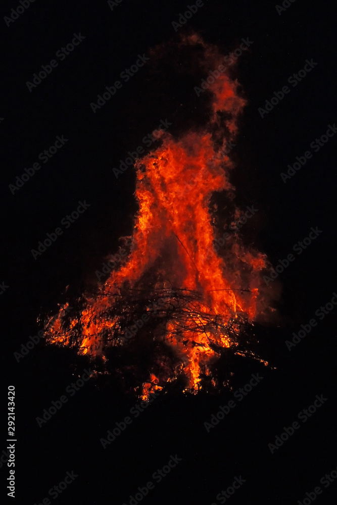 bonfire burns at night