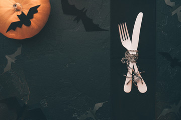Photo of halloween pumpkin, knife, fork, bat .