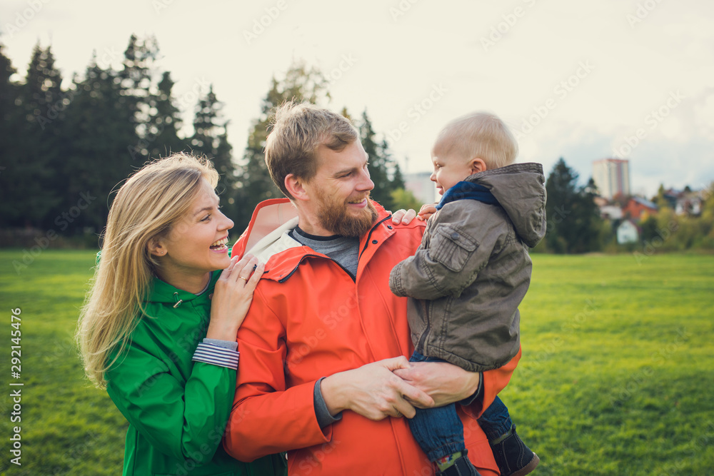 happy family in autumn forest walk and have fun together happy family in autumn forest walk and have fun together