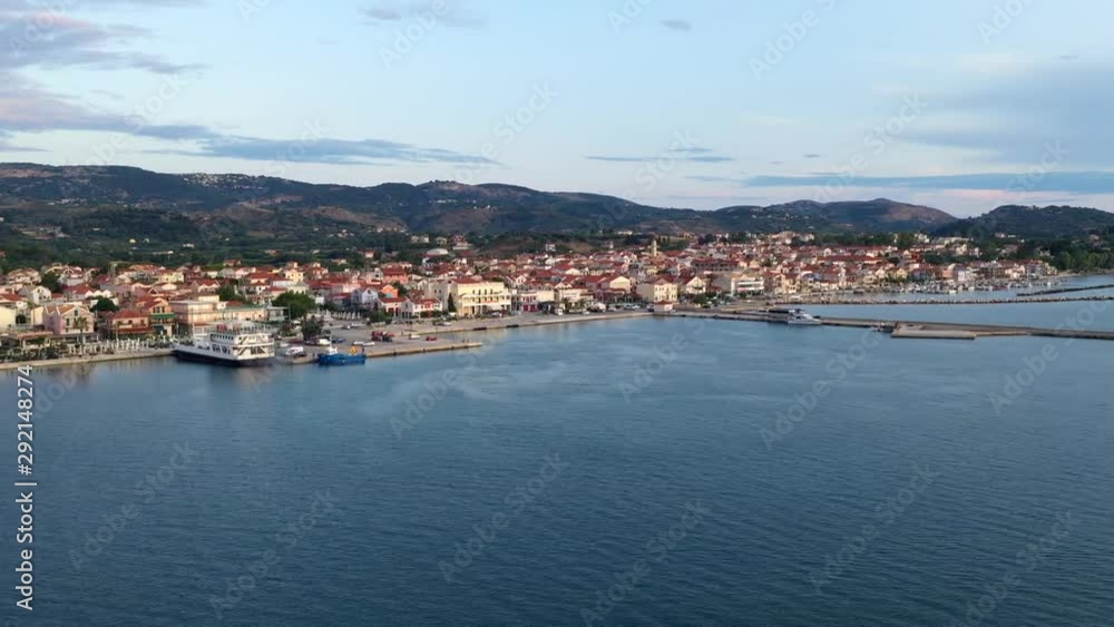Soothing calm Lixouri town port ferries leaving dock harbour in the evening, aerial time lapse shot Soothing calm Lixouri town port ferries leaving dock harbour in the evening, aerial time lapse shot