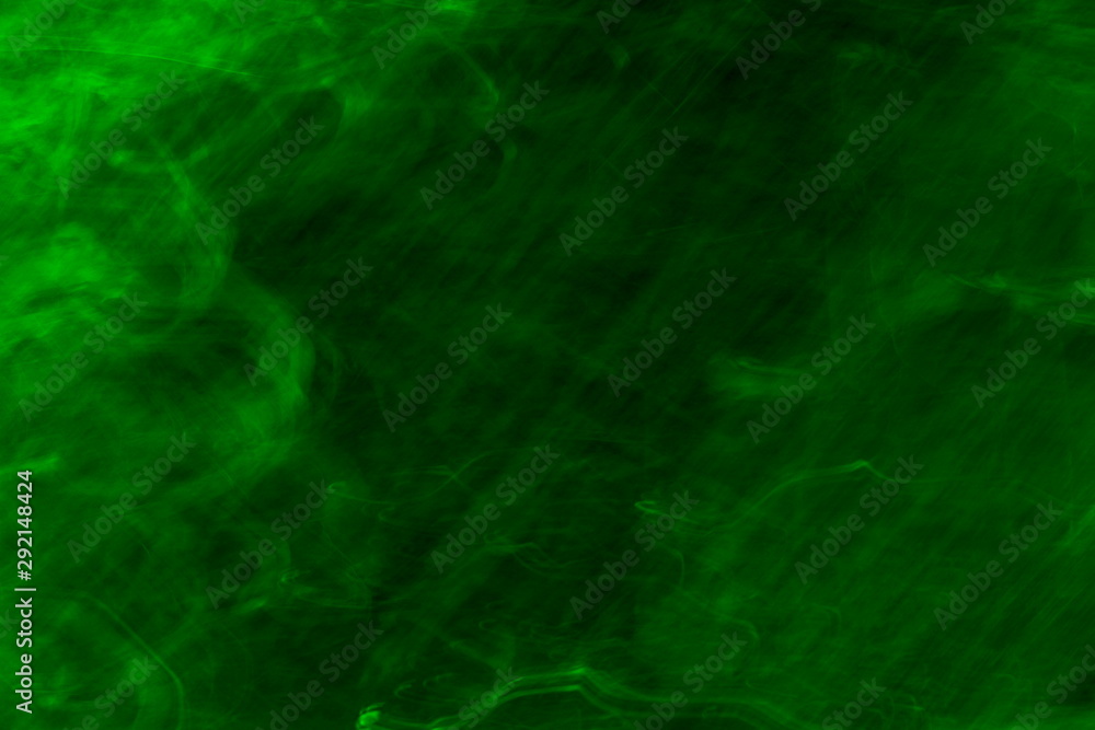 Dark green abstract blurry textured background