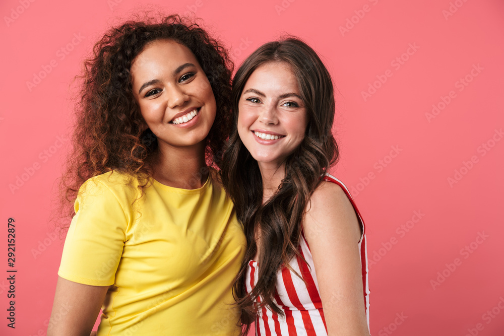 Image of amazing multinational girls smiling together at camera Image of amazing multinational girls smiling together at camera
