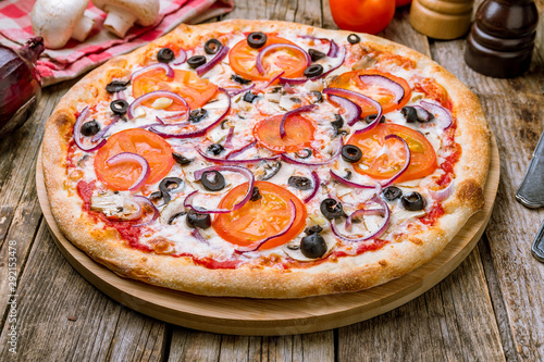 Pizza with vegetables vegetarian on wooden table