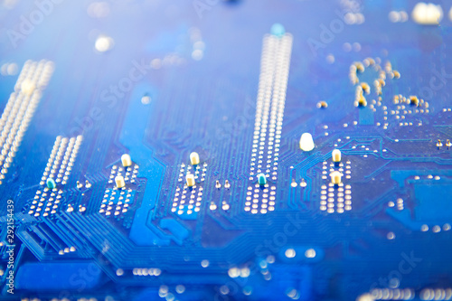 blue computer motherboard close up Electronic with microchips and transistors