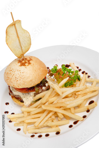 Burger with fries and tomato sauce on a plate on a white isolated background