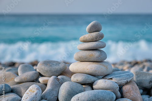 Zen balanced stones stack on beach photo
