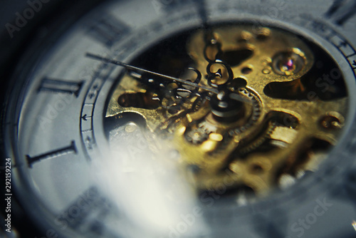 Time. Macro photo of a pocket`s watch analog mechanism