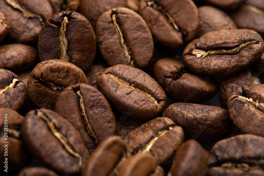 Fototapeta premium Coffee beans close-up background. Fresh roasted