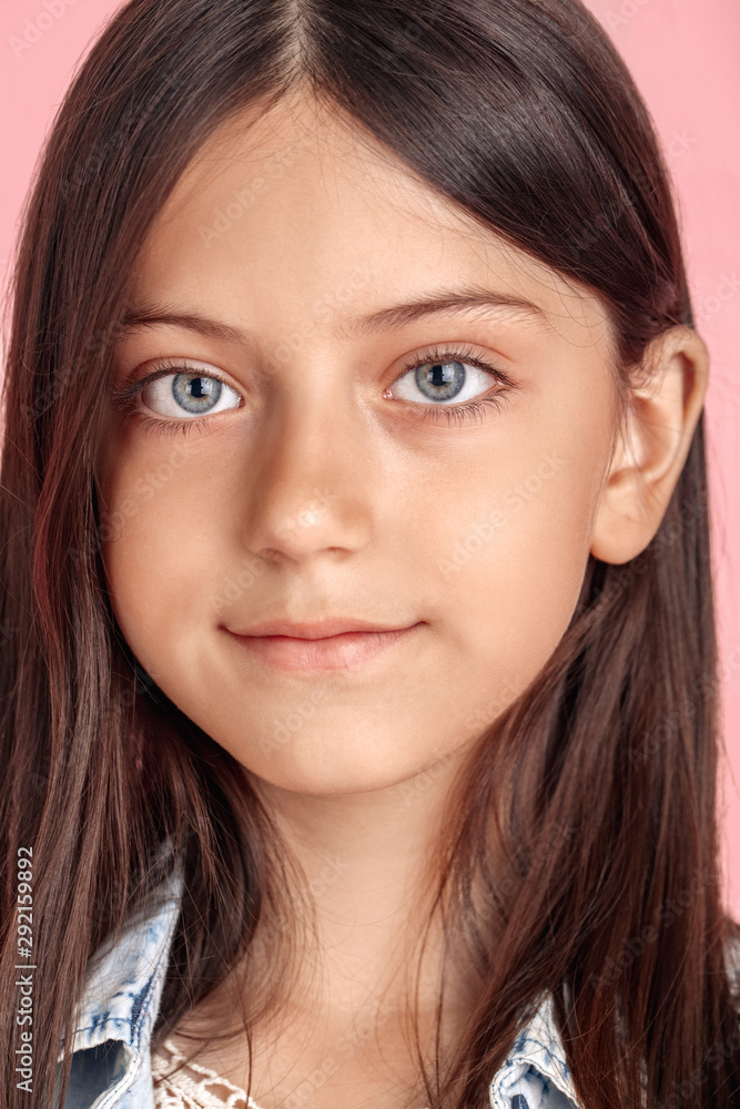 Freestyle. Young girl standing isolated on pink smilign pretty close-up Freestyle. Young girl standing isolated on pink smilign pretty close-up